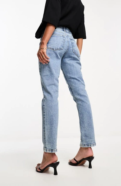 Shop Asos Design High Waist Slim Mom Jeans In Mid Blue
