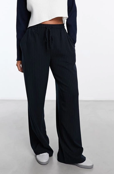 Shop Asos Design Stripe Tie Waist Wide Leg Pants In Navy