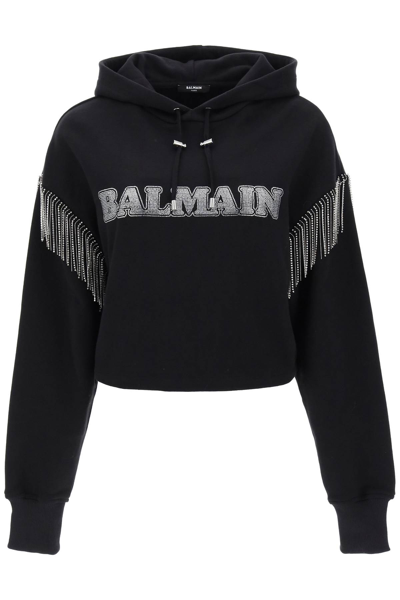 Shop Balmain Cropped Hoodie With Rhinestone Studded Logo And Crystal Cupchains In Black
