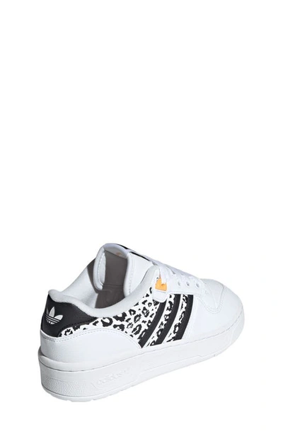 Shop Adidas Originals Rivalry Low Top Basketball Shoe In White/ Black/ Hazy Orange