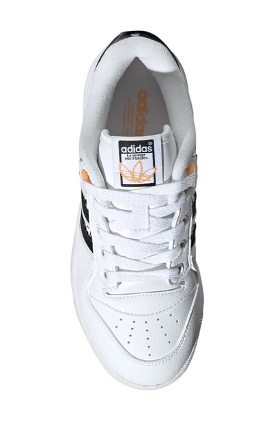 Shop Adidas Originals Rivalry Low Top Basketball Shoe In White/ Black/ Hazy Orange