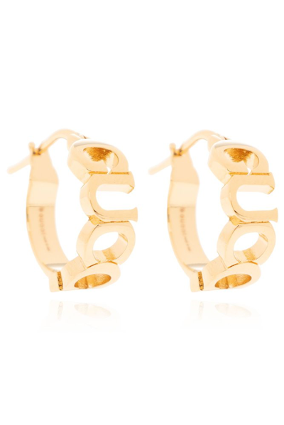 Shop Gucci Logo Lettering Hoop Earrings In Gold