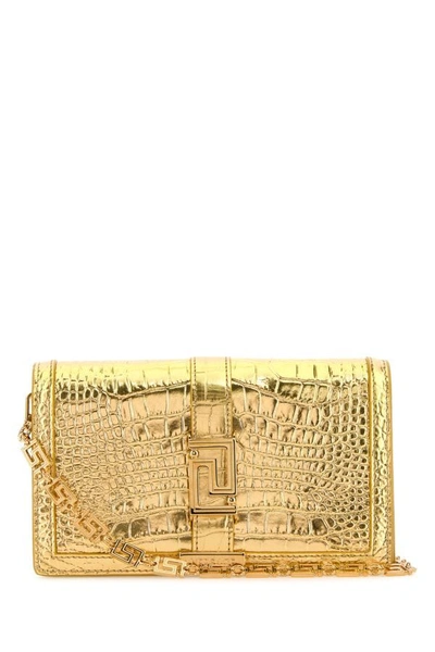 Shop Versace Woman Gold Leather Greca Goddess Clutch