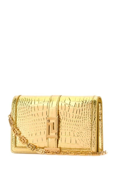 Shop Versace Woman Gold Leather Greca Goddess Clutch