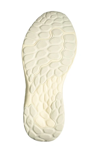 Shop New Balance Fresh Foam Arishi V4 Sneaker In Dolce/ Gold