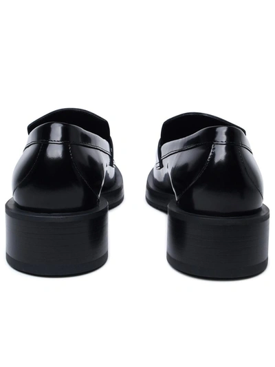 Shop Stuart Weitzman Black Shiny Leather Loafers