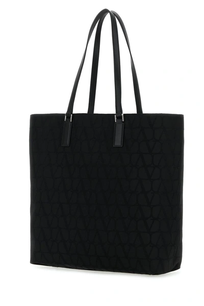 Shop Valentino Garavani Handbags. In Black