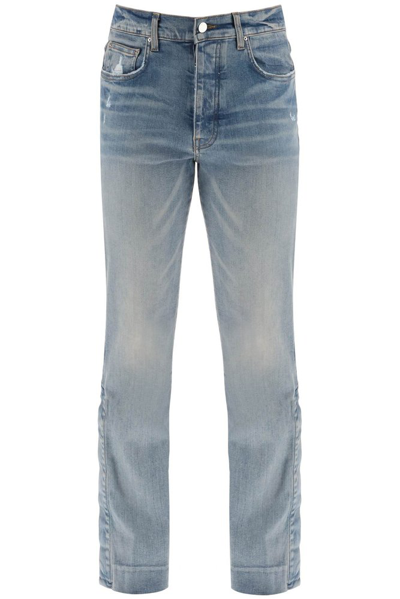 Shop Amiri Stacked Flared Distressed Jeans In Blue