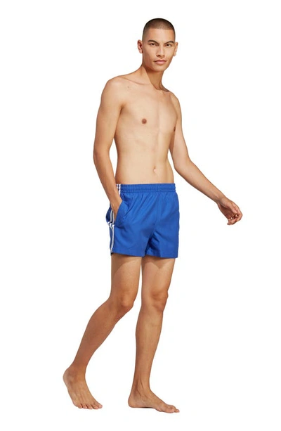 Shop Adidas Originals Original 3-stripes Swim Shorts In Semi Lucid Blue / White