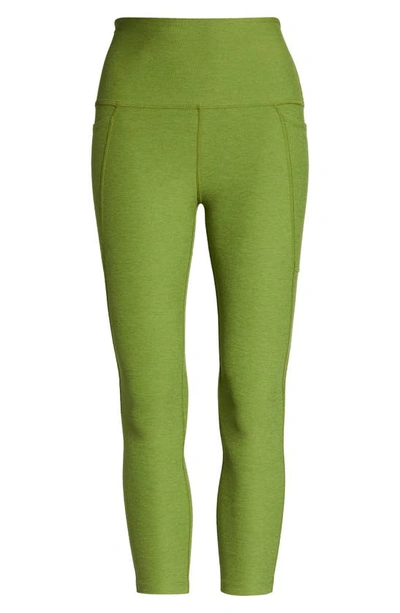 Shop Beyond Yoga Space Dye Out Of Pocket Side Pocket High Waist Capri Leggings In Fern Green Heather