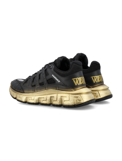 Shop Versace The Trigreca Trainers In Black/gold