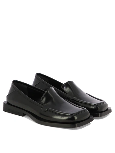 Attico Micol Asymmetric-toe Leather Loafers In Black