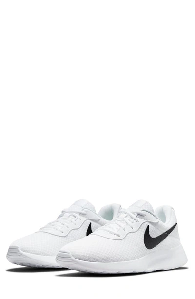 Shop Nike Tanjun Athletic Sneaker In White/black-barely Volt