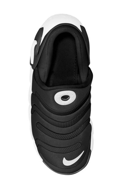 Shop Nike Kids' Dynamo Go 2 Sneaker In Black/ White