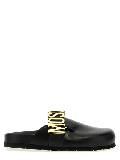 Shop Moschino Logo Mules In Black