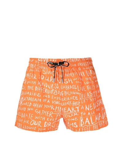 Shop Balmain Slogan All-over Logo Swim Shorts In Orange