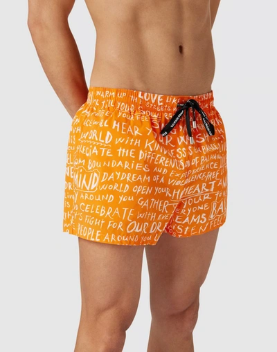 Shop Balmain Slogan All-over Logo Swim Shorts In Orange