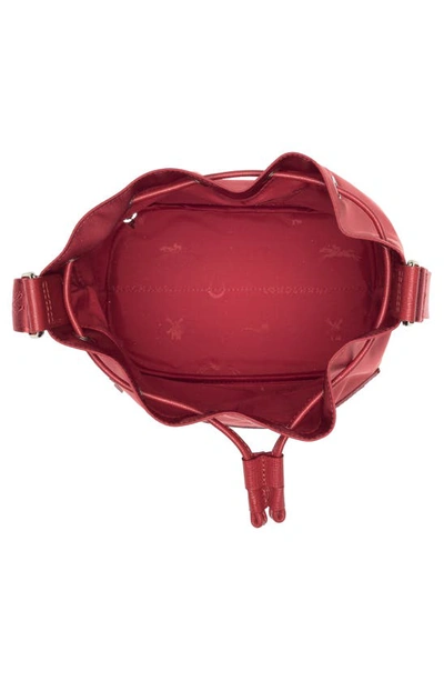 Shop Longchamp Neoprene Bucket Bag In Red