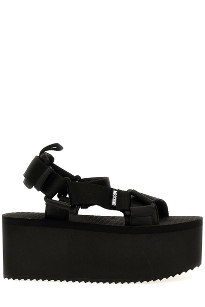 Shop Moschino Logo Detailed Platform Sandals In Black