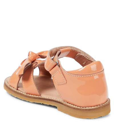 Shop Petit Nord Bow Patent Leather Sandals In Orange