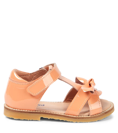 Shop Petit Nord Bow Patent Leather Sandals In Orange