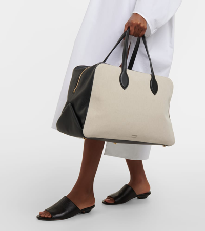 Shop Khaite Maeve Large Canvas And Leather Duffel Bag In Neutrals