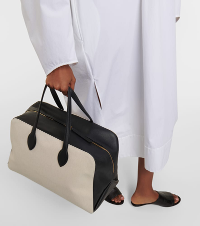 Shop Khaite Maeve Large Canvas And Leather Duffel Bag In Neutrals