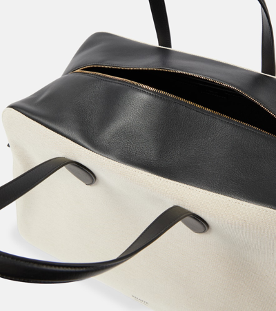 Shop Khaite Maeve Large Canvas And Leather Duffel Bag In Neutrals