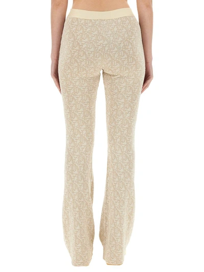 Shop Palm Angels Monogram Pants In White