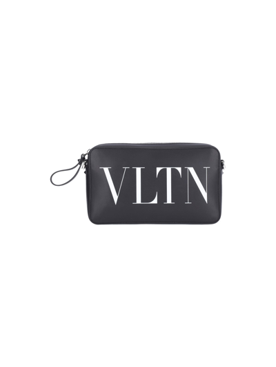 Shop Valentino "vltn" Crossbody Bag In Black  
