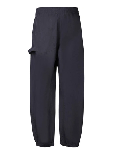 Shop Jw Anderson Embroidered Logo Trousers In Blue