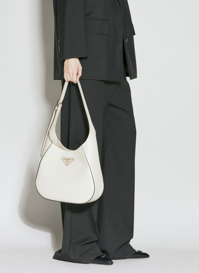 Shop Prada Logo Plaque Leather Shoulder Bag In Beige