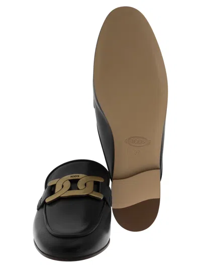Tod's Glossy Black Slippers With Logo Plaque