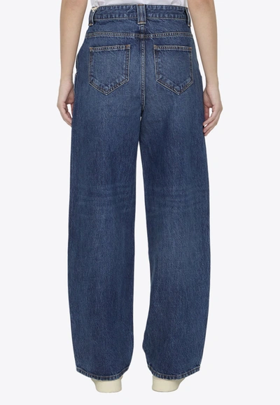 Shop Khaite Bacall Washed-out Jeans In Blue