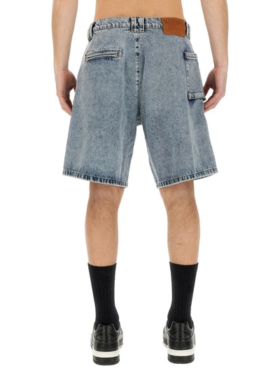 Moschino Ripped Cargo Denim Shorts In Denim