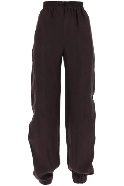 Shop Attico Monogram Jacquard Pants In Brown