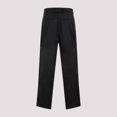 Shop Amiri Side Pleat Snap Pants In Black