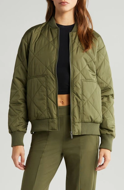 Shop Zella Quilted Side Zip Bomber Jacket In Olive Night