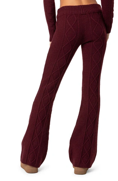 Shop Edikted Ray Cable Stitch Flare Sweater Pants In Burgundy