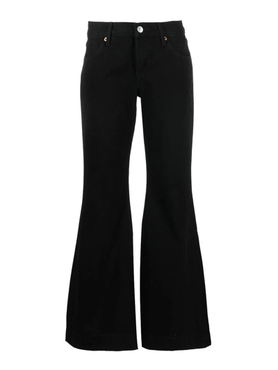 Shop Re/done 70s Mid-rise Flared Jeans In Black