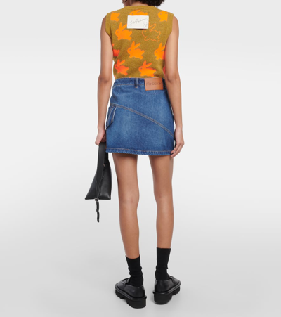 Shop Jw Anderson Twisted Asymmetric Denim Miniskirt In Blue