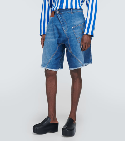 Shop Jw Anderson Twisted Low-rise Denim Shorts In Blue