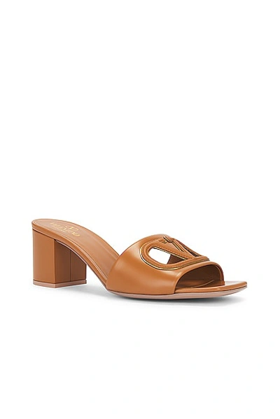 Shop Valentino V Logo Cut Out Mule In Almond Beige & Antique Brass