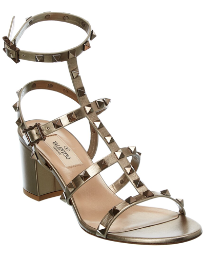 Shop Valentino Rockstud Caged 60 Leather Ankle Strap Sandal In Gold