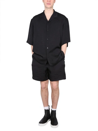 Shop Moschino Viscose Satin Logo Shorts In Black