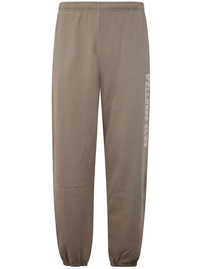 Shop Sporty And Rich Sporty & Rich Wellness Club Logo Detailed Track Pants In Beige