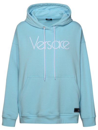 Shop Versace Woman Light Blue Cotton Sweatshirt