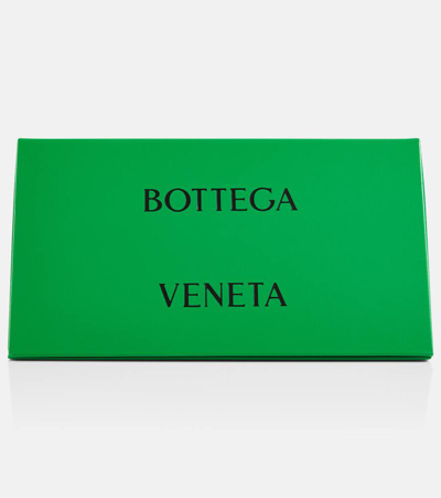 Shop Bottega Veneta Knot Shield Sunglasses In Gold