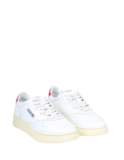Shop Autry Sneakers In White Leather In White/red