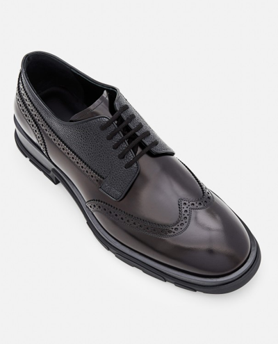 Shop Alexander Mcqueen Leather Brogue Shoes In Black